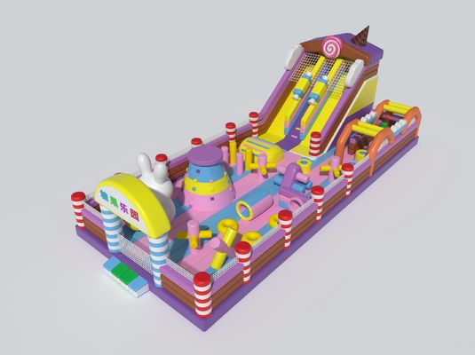 Château gonflable à thème de bonbons avec des grandes glissades